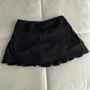 Like new! Black Ivivva tennis skirt with built in shorts for girls. US size 10.